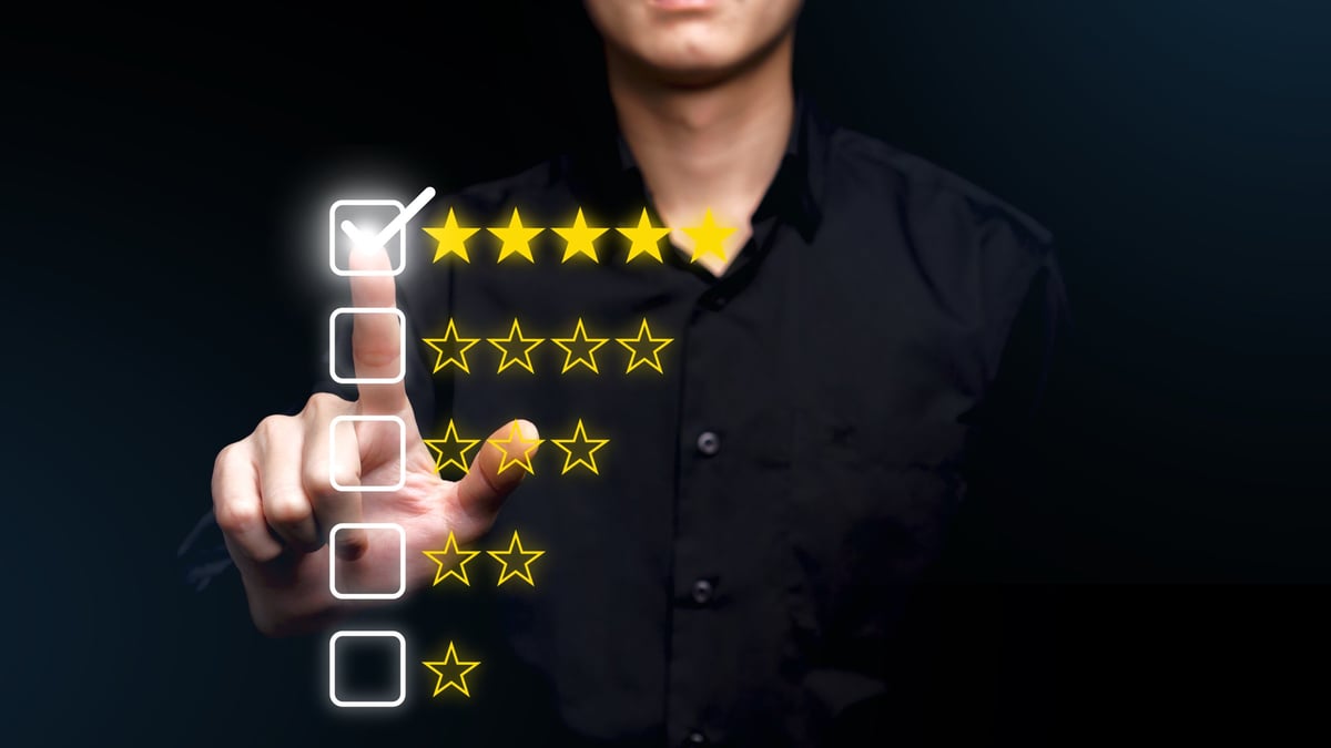 Person rating an experience with a glowing five-star interface